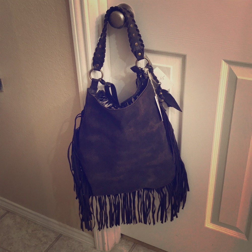 NWT Fringe purse. Perfect condition.